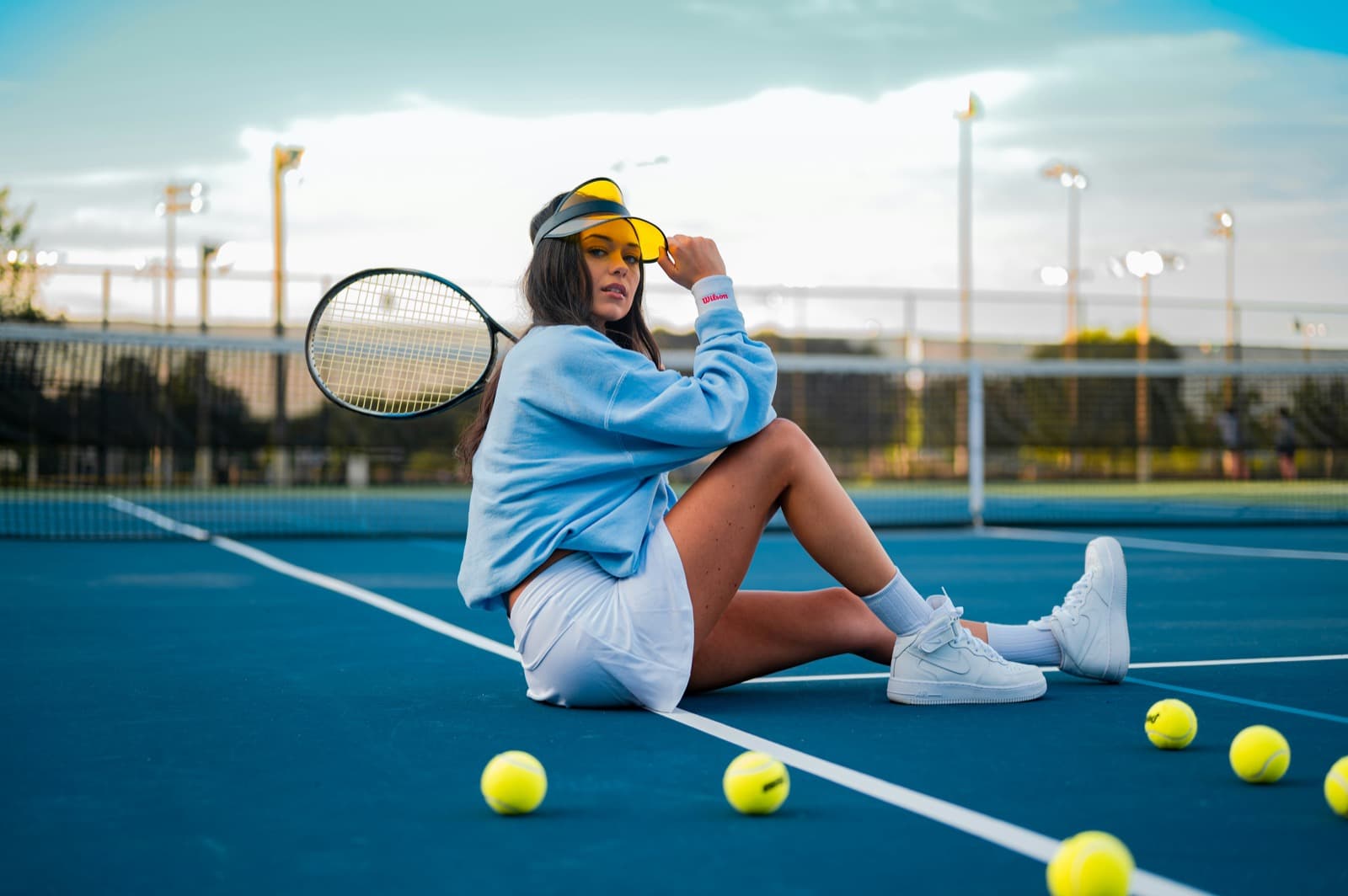 Player resting courtside between sets